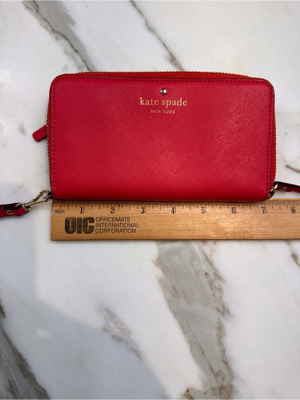 kate spade red zip-around wristlet clutch with gold logo